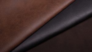 Detailed close-up of brown and black leather textures, perfect for fashion and design projects.